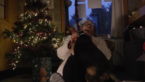 Woman-enjoying-her-time-during-christmas-with-her-dog