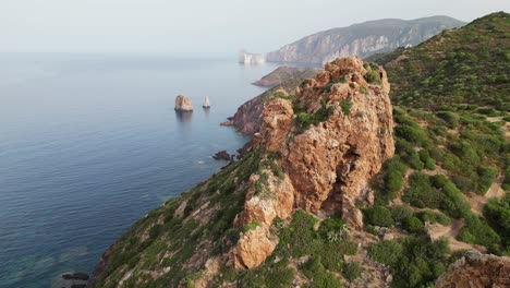 Rocks-and-Steep-Cliffs-at-Pan-di-Zucchero,-Masua,-Sardinia,-Italy---4k-Aerial