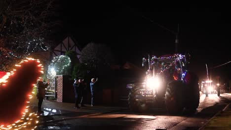 Santa-on-the-Sleigh-within-the-Festive-Hope-Tractor-Run,-Horseman's-Green,-Whitchurch,-United-Kingdom