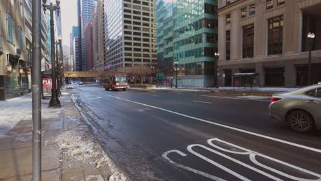 Chicago,-IL-USA--December-25th-2022:-wide-angle-footage-of-a-red-fire-truck-speeding-down-the-street-of-Chicago-after-the-winter-storm-passed-to-help-in-a-emergency