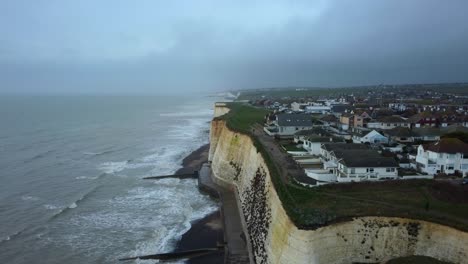 Drone-shot-Peacehaven-town-and-coastline-in-East-Sussex-in-England