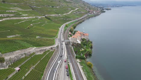 aerial-view,-tilt-up,-lavaux-vineyards-in-Switzerland,-next-to-geneva-lake