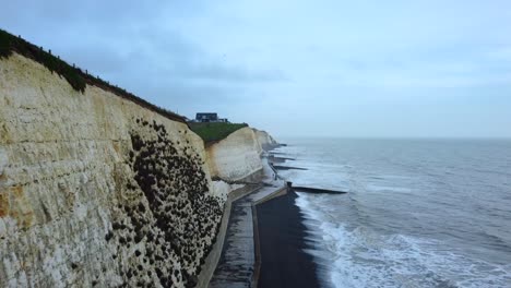 Chalk-cliffs-on-coast-with-sea-water-erosion-and-climate-change-damage