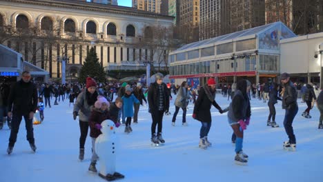 Slow-motion-shot-of-people-ice-skating-in-Bryant-park-of-New-York-city
