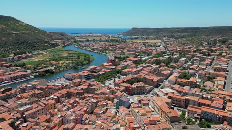 Bosa-city-and-Temo-River-at-West-Coast-of-Sardinia,-Italy---4k-Aerial