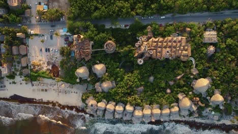 Top-down-aerial-view-lowering-over-top-of-the-Azulik,-Resort-in-Mexico