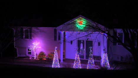 Colorful-Lights-With-Mini-Christmas-Trees-In-Front-Of-A-House-In-A-Small-Village-In-The-USA