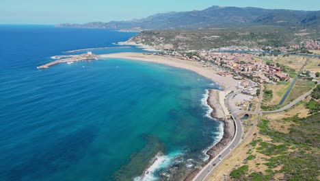 Bosa-Marina-sandy-beach-and-coastline-of-Oristano-in-Sardinia,-Italy---4k-Aerial