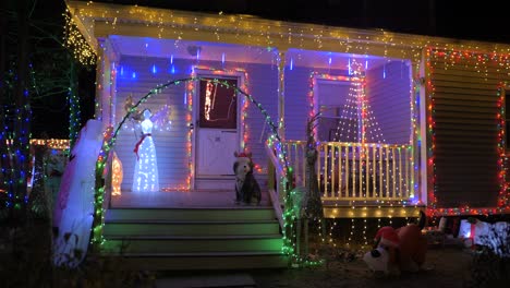 A-House-With-Wooden-Porch-Decorated-With-Dazzling-Christmas-Lights