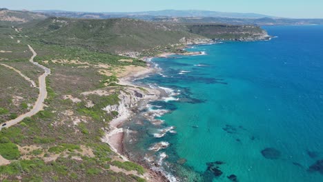 Coastal-Road-and-Turquoise-Blue-Sea-at-West-Coast-of-Sardinia,-Italy---4k-Aerial