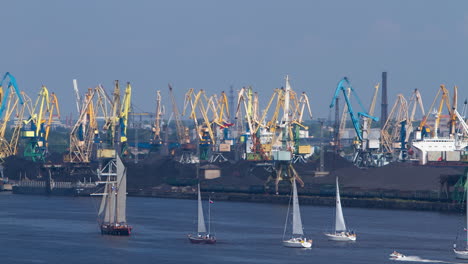 Time-lapse-Sailboat-regata,-industrial-port-background