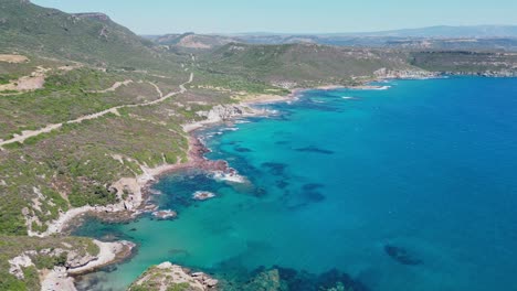 Scenic-West-Coast-of-Sardinia-with-Green-Mountains-and-Turquoise-Blue-Sea---4k-Aerial