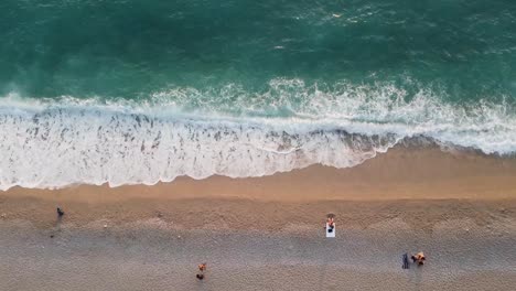 Aerial-view-of-people-resting-and-disconnecting-at-Kidrak-Beach-in-Turkey