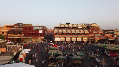 Morocco,-Marrakesh,-turning-timelapse-video-about-the-crowded-marketplace-over-the-Avenue-Jamaa-El-Fna