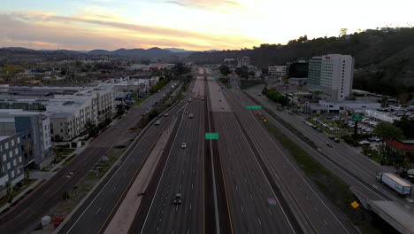 Highway-8-in-Mission-Valley,-San-Diego-California,-drone-backwards