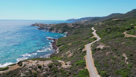 Scenic-Coastal-Road-and-blue-sea-at-West-Coast-of-Sardinia,-Italy---4k-Aerial