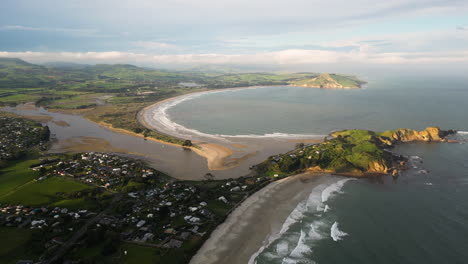 Huriawa-Historic-Site-peninsula-located-in-New-Zealand,-aerial-drone-distance-view