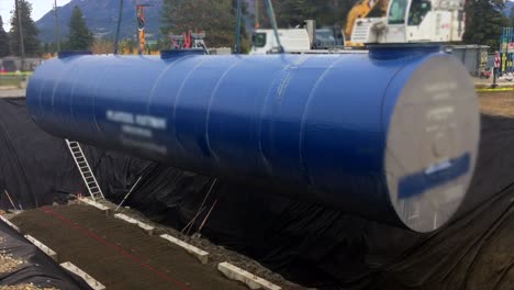 Huge-Fuel-Storage-Tank-Lifted-into-Pit-by-Mighty-Heavy-Duty-Crane