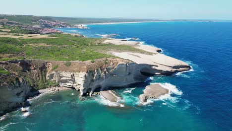 Steep-white-cliffs-and-coastline-in-S'-Archittu,-Sardinia,-Italy---4k-Aerial