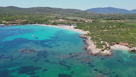 Cala-Spinosa-Beach-at-Capo-Testa,-Santa-Teresa-di-Gallura,-Sardinia,-Italy---4k-Aerial-Circling