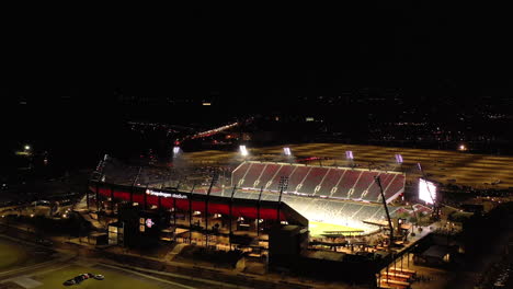 Drone-orbit-at-night-around-Snapdragon-Stadium-in-Mission-Valley,-San-Diego
