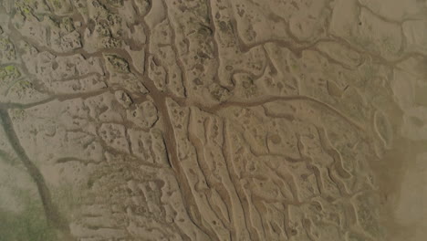 Top-Down-Aerial-Drone-Shot-over-Abstract-Sand-Estuary-Creek-in-Wells-Next-The-Sea-North-Norfolk-UK