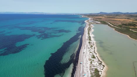 Salt-Lake,-Sandy-Beach-and-Turquoise-Blue-Sea-in-Stintino,-Sardinia,-Italy---4k-Aerial