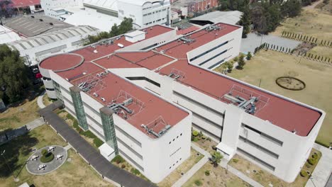 Lowering-drone-shot-of-the-Fisiologia-and-Famacia-buildings-at-the-University-of-Mexico-