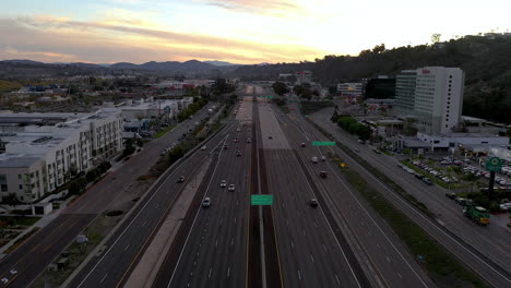 Cars-driving-on-highway-8-freeway-in-San-Diego,-California-at-sunrise