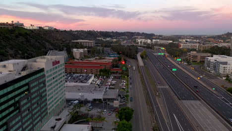 Aerial-view-of-the-Hilton-Hotel-San-Diego-Mission-Valley-next-to-freeway-interstate-8-at-sunrise