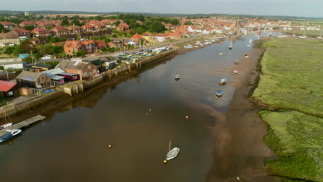 Establishing-Drone-Shot-Along-Wells-Next-The-Sea-Coastal-Town-Creek-North-Norfolk-UK-East-Coast