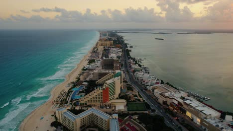 Aerial-view-of-Cancun,-Mexico-filled-with-tourism-and-a-beautiful-sunset