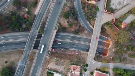 Top-down-aerial-view-of-cars-driving-on-highways-in-Spain