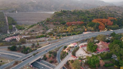 Aeiral-view-of-the-Jardin-Botánico-in-Málaga,-Spain-located-betweena-a-dam-and-a-highway