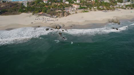 Aerial-view-of-Puerto-Escondido's-white-beach-shoreline-in-Mexico