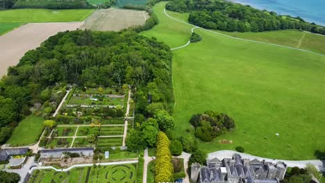 An-aerial-pullback-shot-of-Ardgillan-Gardens-by-Ardgillan-Castle-North-County-Dublin-Rose-Garden,-Walled-Garden,-Seasonal-Garden