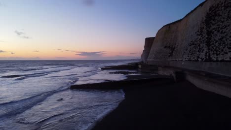 Drone-Shot-Brighton-Coast-And-Beach-With-Cliffs-At-Sunset-In-England