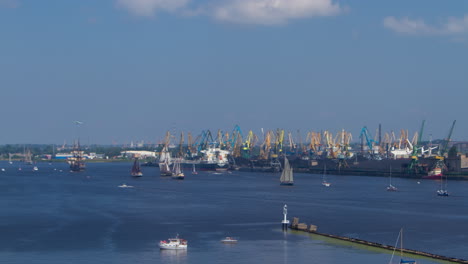 Time-lapse-Sailboat-regata,-industrial-port-background