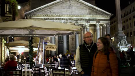 Outdoor-dining-at-a-restaurant-in-Rome,-Italy-at-night-outside-the-Pantheon