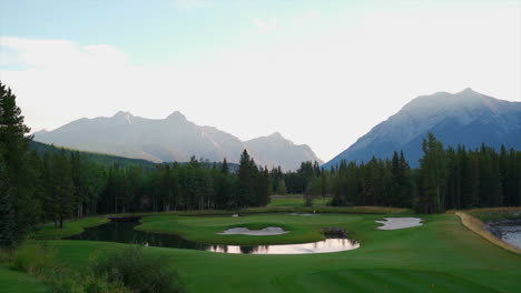 Beautiful-morning-on-green-golf-course-in-the-rocky-mountains-of-Banff-and-Kananaskis-of-Alberta,-Canada
