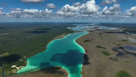Aerial-view-overlooking-the-Lagoon-of-Seven-Colors-in-sunny-Bacalar,-Mexico