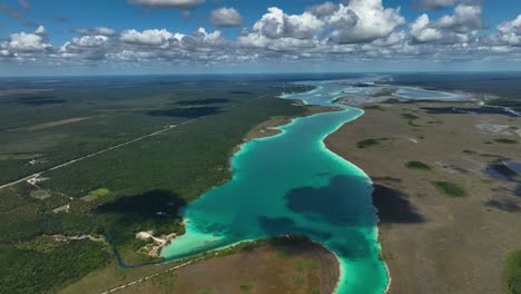 Vibrant-waters-at-the-Rapidos-de-Bacalar-in-sunny-Quintana-roo,-Mexico---Aerial-view