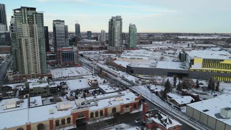 Aerial-drone-flyover-of-the-Stampede-LRT-station-under-construction-in-winter