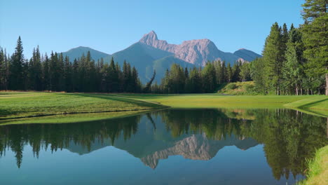 Green-golf-course-in-the-rocky-mountains-of-Banff-and-Kananaskis-of-Alberta,-Canada