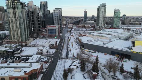 Aerial-drone-flyover-of-the-Stampede-LRT-station-under-construction-in-winter