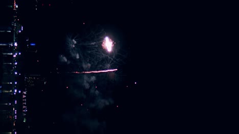 New-year's-eve-fireworks-display-celebration-loop-seamless-of-real-fireworks-background-with-abstract-multicolor-big-shining-glowing-fireworks-show-with-bokeh-lights-in-the-night-sky