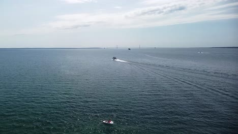 Mackinac-Bridge-with-Boat-and-Ferry-Drone-Shot