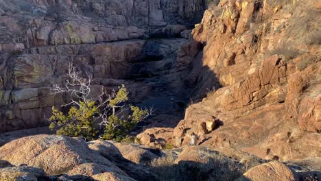 Man-climbs-around-ravine-canyons-in-rural-Oklahoma