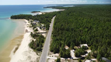 Lake-Coast-With-Beach-Road-Aerial-Shot