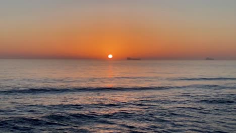 4K-Timelapse-Orange-Sunset-Beach-Over-Ocean-Beautiful-Sea-Water-Waves